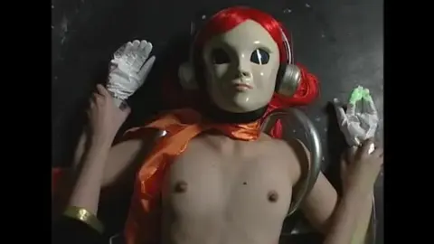 Red-Haired Women in Wrestling Costumes Engage in Cage Fight