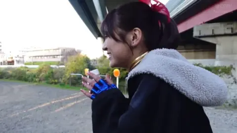 Asian Girl in Blue Costume and Red Bow