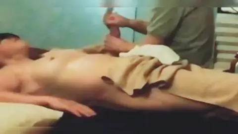 Men Receiving Massage in Bedroom