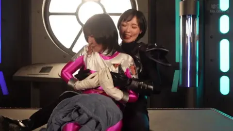 Asian Lesbian Duo in Futuristic Setting