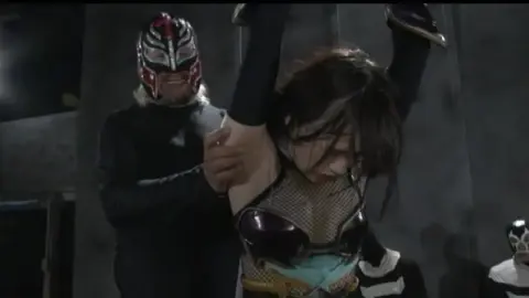 Asian Couple in Dimly Lit Room