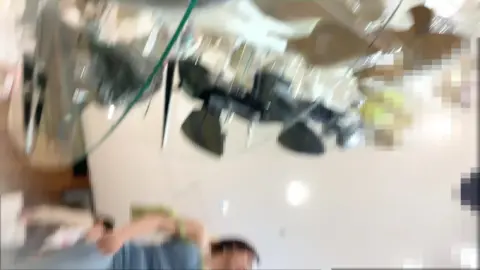 Teen in Black Skirt Playing with Shoe