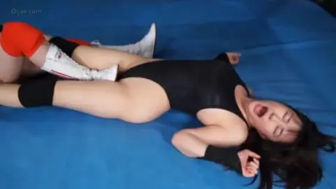 Asian Women Wrestling in Leotards