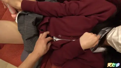 Asian Couple Intimate Moments on Red Couch