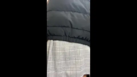 Girls in Checkered Skirts at Subway Station