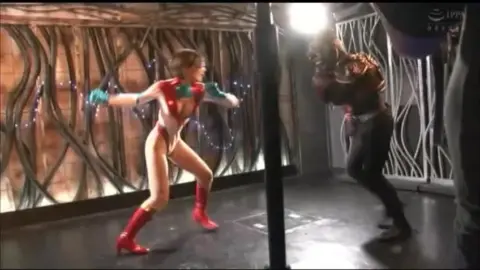 Asian Wrestlers in Costumes Engage in Dramatic Matches