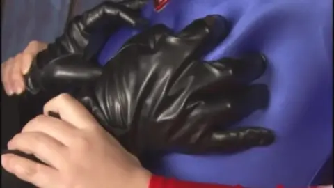 Asian in Red Costume Featured in Fetish Scenes