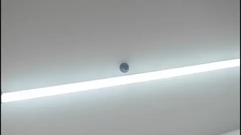 Asian Store Clerk in Uniform