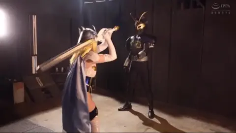 Blonde in Blue Mask and Costume