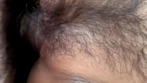 Asian Couple Engaging in Intimate Activity