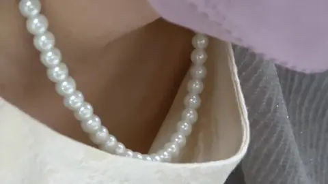 Asian teen drying off with towel