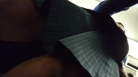 Slim Caucasian Woman Adjusts Clothing