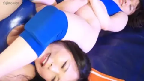 Brunettes in Blue Swimsuits Wrestling