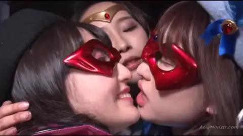 Asian Lesbians in Red Masks Kissing and Touching