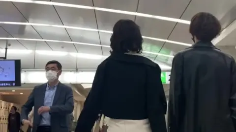 Couple’s Intimate Subway Encounter