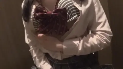 Asian Schoolgirl Exposes Herself in Dimly Lit Bathroom