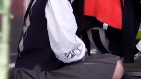 Asian Office Girl Crouching and Laughing