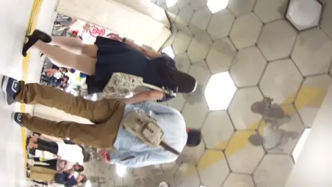 Asian Couples in Clothing Store