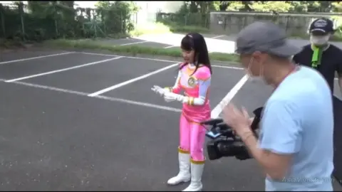 Asian Girl in Pink and Yellow Costume Outdoor