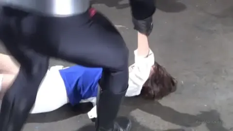 Asian Lesbians in Costumes Engage in Intimate Moments