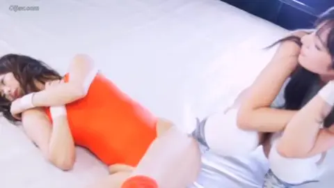 Asian Lesbians Intimate Moments on Bed