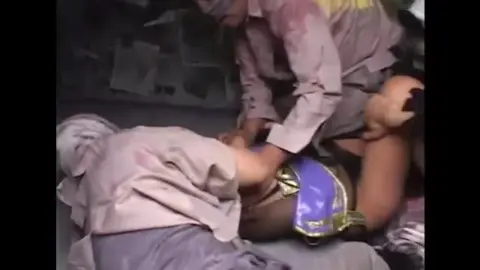 Asian Woman in Purple Outfit Assaulted by Multiple Men