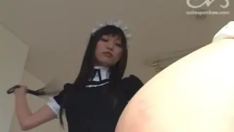 Asian Lesbians in Maid Costumes Engage in BDSM Spanking