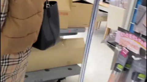 Asian Teen Shopping in Store