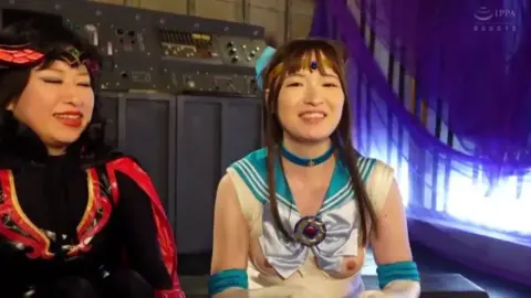 Women Sitting and Smiling