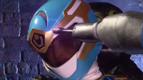 Asian Women in Costumes Engage in Wrestling