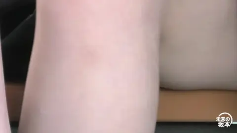 Asian Teen Sits with Skirt Lifted