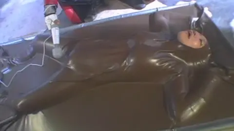 Asian Performers in Fetish Outfits Engage in Erotic Acts