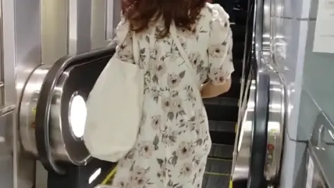 Asian Woman Walking and Changing Clothes
