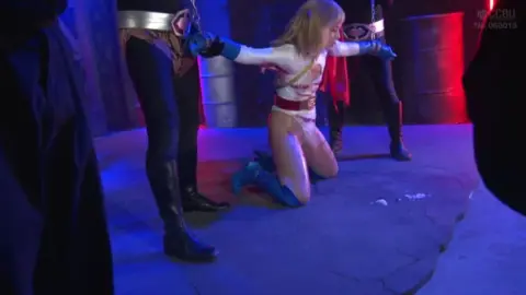 Superhero Costume Sex in Neon Lit Warehouse