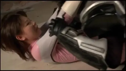 Asian Woman in White Gloves with Robot in Industrial Setting