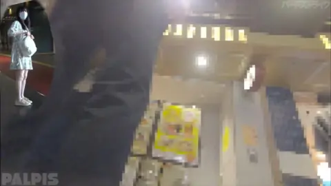 Asian woman in white face mask at shopping mall