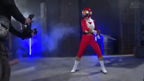 Asian Performers in Costumes on Stage