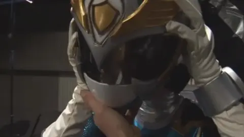 Asian Performer in Silver Costume