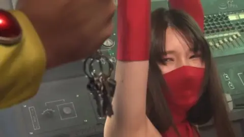 Asian Beauty in Red Bodysuit and Mask