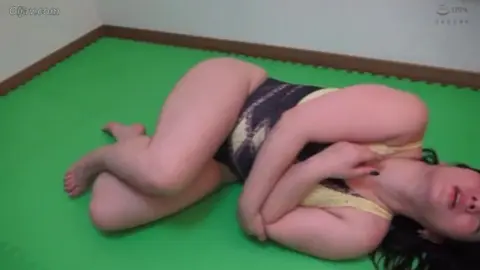 Asian Women Engaging in Erotic Grappling