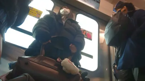 Asian Teen in Plaid Skirt on Public Transport