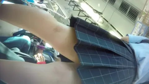 Asian teen exposes herself on train