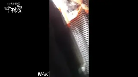 Asian Woman Shopping in Store