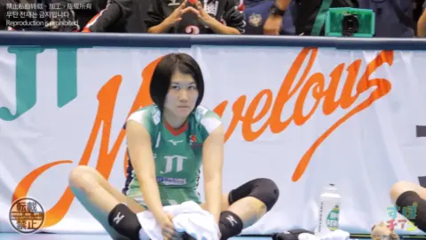 Asian Athletes in Sports Uniforms