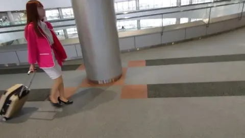 Asian Girl in White Dress at Airport