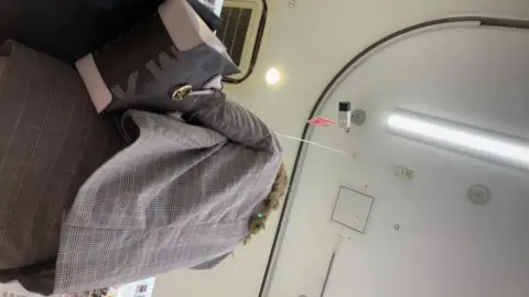 Blonde in Brown Skirt Shopping