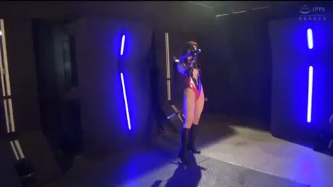 Asian Women in Cosplay Dance with Lightsaber