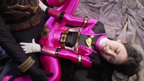 Asian Couple in Futuristic Costume Intimacy