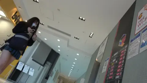 Asian Teen Shows Off Red Underwear in Office