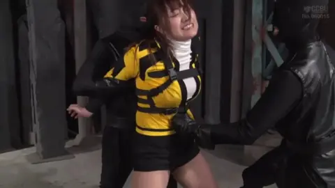 Asian Girl in Black and Yellow Jacket Bondage Scene